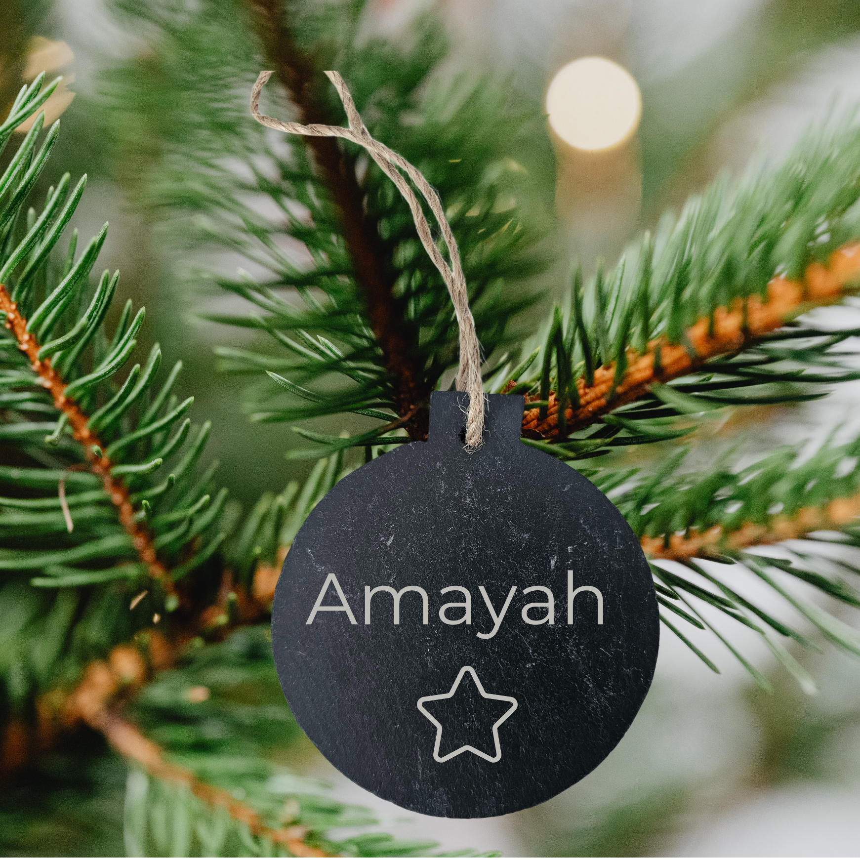 personalised slate bauble shape hanging ornament engraved with a name and star