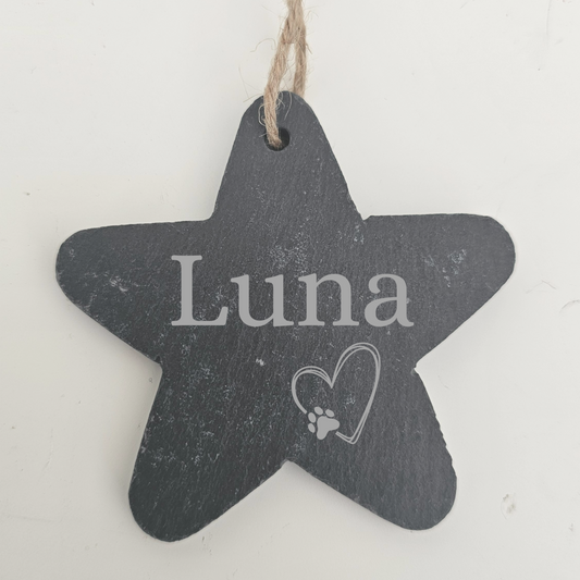 Star-shaped slate sign with 'Luna' and a heart with a paw print on a white background