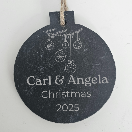 Personalised Christmas ornament with 'Carl & Angela Christmas 2025' text on a white background
