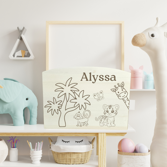 Children's room with a personalised money box for 'Alyssa' on a shelf with toys and décor.