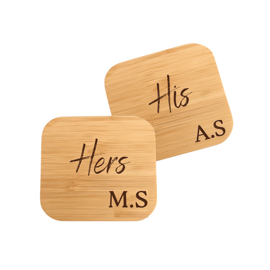Two wooden wireless chargers  with 'His', 'M.S.' and 'Hers', 'A.S.' text on a white background.